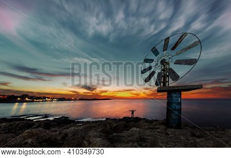 Beautiful View on a Great Windmill over Sunset Sky Background on the Sea Coast. Anfeh. Lebanon