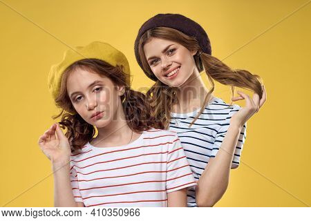 Mom And Daughter Embrace Joy Fun Childhood Lifestyle Yellow Background