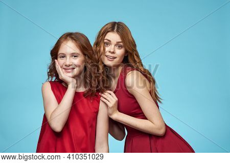 Family Mom And Daughter Hug Red Dresses Communication Emotions Blue Background