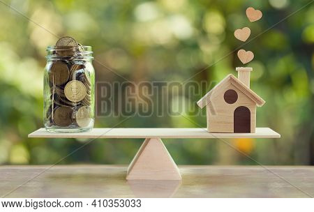 House Mortgage And Family Financial Management Concept: Wooden Home And Heart, Family Member And Us 