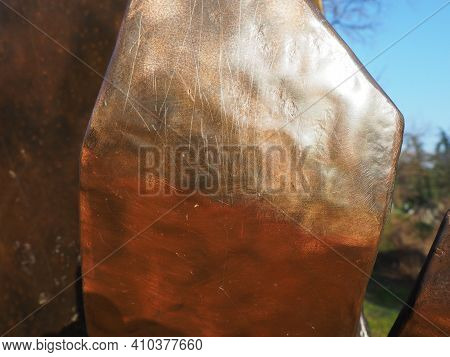 Metal Bronze Textured Plate. Bronze Or Copper Polished Surface With Dents, Scratches And Indentation