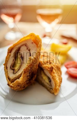 Traditional French Cuisine Chicken Roll Cordon Bleu Or Gordon Blue With Cheese, Ham And Potatoes