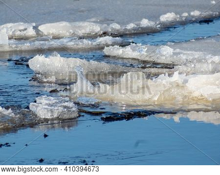 Ice Floating In The Water In Sunlight