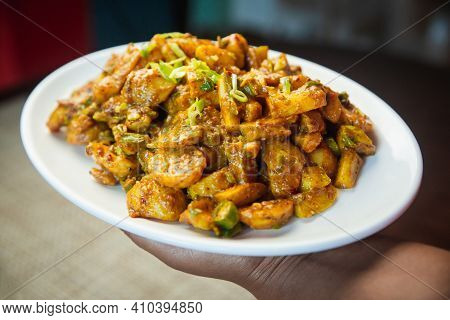 Popular Cucumber And Potato Pickle Served On A Plate. Alu Kakra Ko Achar.spicy Nepali Pickle