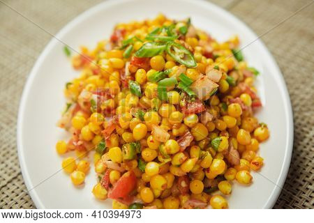 Spicy Sweet Corn Chaat In Indian Style Served On A Plate. Sweet Corn Recipe