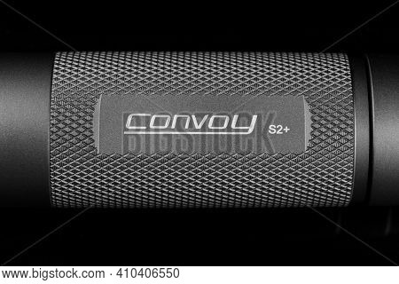 Lviv, Ukraine - February 24, 2021: Convoy S2+ Flashlight Close-up
