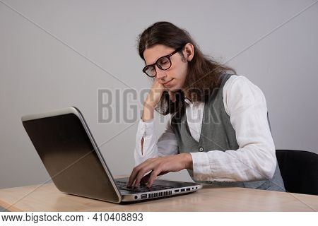 Geek Guy Is Trying To Write Code Or Learn A New Programming Language, Experience Difficulties In The