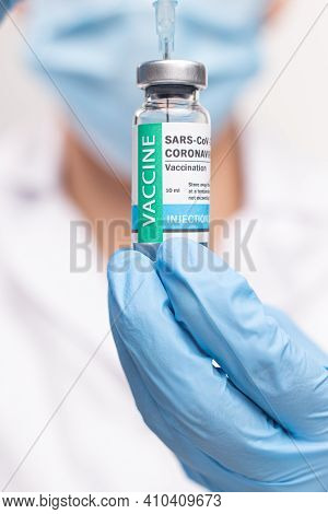 Sars - Cov2 Vaccination Concept. Close Up Covid-19 Vaccine Dose. A Doctor Or Nurse In A Laboratory H