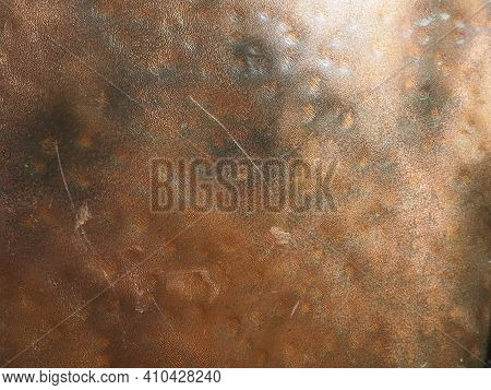 Metal Bronze Textured Plate. Bronze Or Copper Polished Surface With Dents, Scratches And Indentation