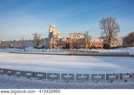 Historical center of Minsk with Traetskae Pradmestse or Trinity Suburb and Svisloch river in winter, Belarus