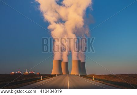 Temelin, Czech Republic - 02 28 2021: Nuclear Power Plant, Cooling Towers With White Water Vapor