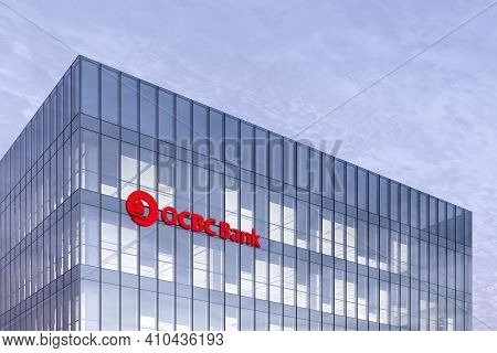 Singapore. February 27, 2021. Editorial Use Only, 3d Cgi. Ocbc Bank Signage Logo On Top Of Glass Bui