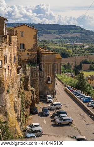Modern Cars On Street Of  Medieval Town Of Orte In Italy.