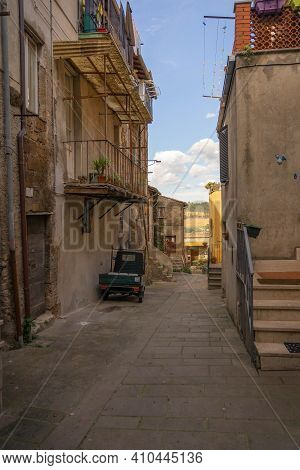 Modern Cars On Street Of  Medieval Town Of Orte In Italy.