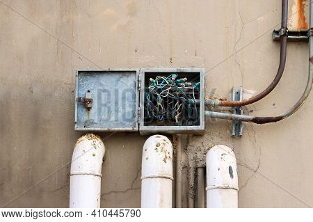 Electric Box Is Very Old, Tangled Wire And Around The Box Is Dirty From Bird Droppings