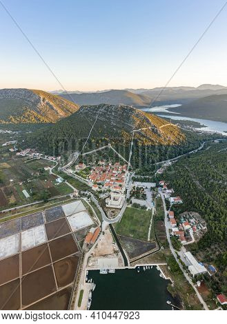 Aerial Drone Shot Of Ston City Wall Over Hill In Ragusa Region Near Dubrovnik In Croatia Summer Sunr