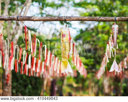Japanese Carp Kites And Ribbons Decorate In The Garden On The Children's Day.