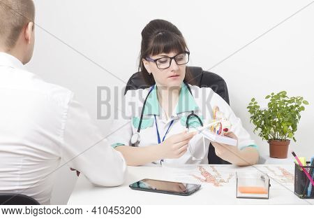 Male Patient At An Appointment With A Doctor Of An Otolaryngologist. Ear, Throat And Nose Disease Co