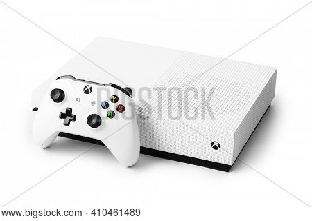 Moscow, Russia - April 18, 2019: Wireless gamepad and Xbox console - isolated on white background.