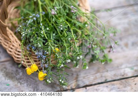 Bouquet Of Medicinal Plants In Basket On A Wooden Table. Fumaria Officinalis, Myosotis Stricta, Ranu