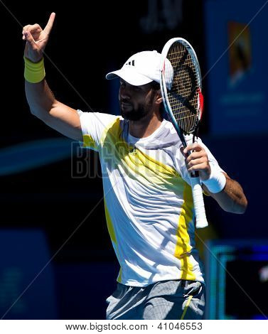 MELBOURNE - 14 gennaio: Fernando Verdasco di Spagna nella sua prima vittoria rotonda sopra David Goffin di Belg