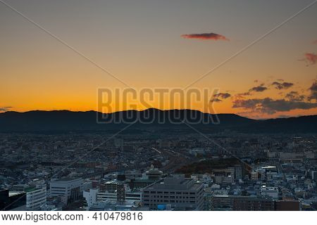 Cityscape Colorful Night View Against Cloudy Sky At Day Time