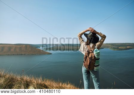 Young Woman In Casual Outfit And Cowboy Hat Enjoying Beautiful View Of Dniester River From High Hill