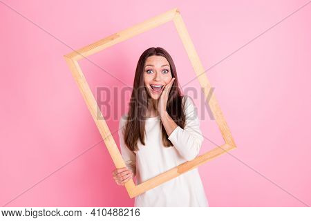 Photo Of Charming Excited Young Lady Wear White Shirt Arm Cheek Hlding Wooden Frame Isolated Pink Co