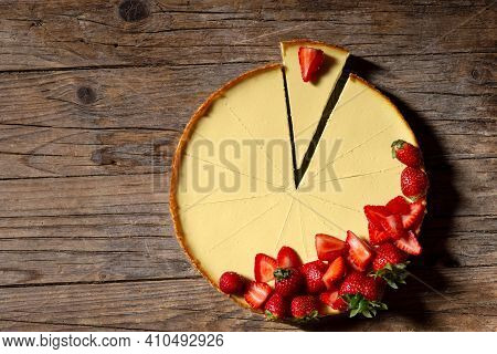 Top Viev. Delicious Homemade Creamy Mascarpone New York Cheesecake With Berries On Dark Wooden Table