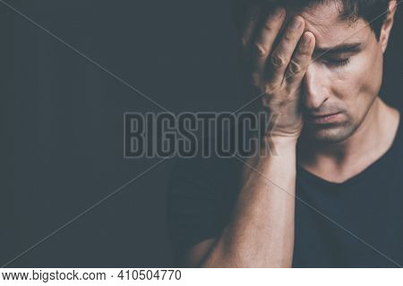 Young man suffering from anxiety, depression due to social seclusion, isolation, COVID induced lockdown