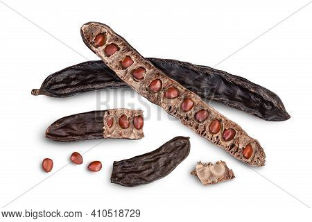 Ripe Carob Pods And Bean Isolated On White Background With Clipping Path And Full Depth Of Field. To