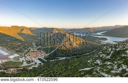 Aerial Drone Shot Of Ston City Wall Over Hill In Ragusa Region Near Dubrovnik In Croatia Summer Sunr