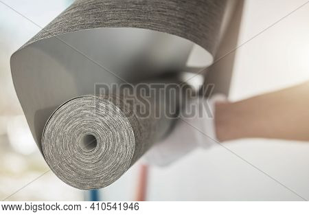 Caucasian Interior Remodeling Worker With Roll Of Modern Vinyl Wallpaper Preparing For Wallcover Ins