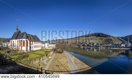 Skyline Of Bernkastel-kues With River Mosel And Cusanus Stift In Foreground