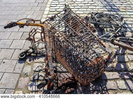 Rusty And Damaged Shopping Cart Found In The Port Of Kiel In Germany