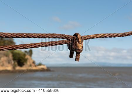 Traditional, Old, Rusty Turnbuckle At China Campr, Viewed From Close, Against Blue Sky