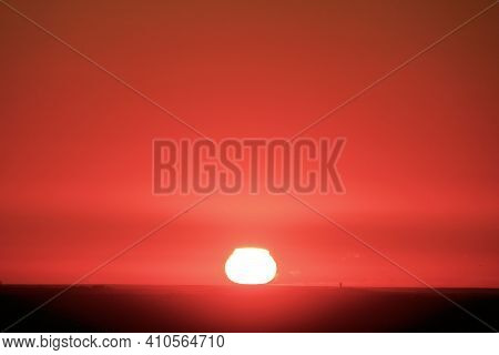 Sun Setting Over The Horizon Creating A Colorful Sky Taken At The California Coastline