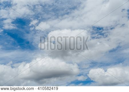 Beautiful Blue Sky With Whipped White Clouds That Are Illuminated By The Sun.