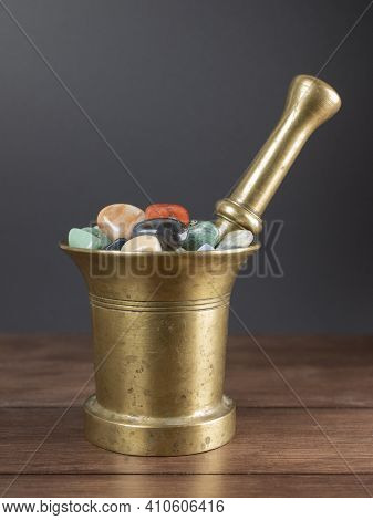 Multicolored Stones And Minerals In The Old Mortar With Pestle. Concept Of Lithotherapy, Ancient Med