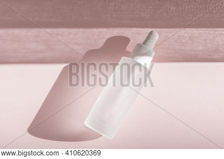 Skin Moisturizing Serum On Pink Backdrop With Shadow. Beauty Skincare Essence Mockup Tincture Flat L