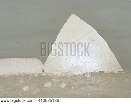 Melting Ice Block Seen On The Beach Of Glacier Lagoon. The Melting Glacier Ice Is An Important Water