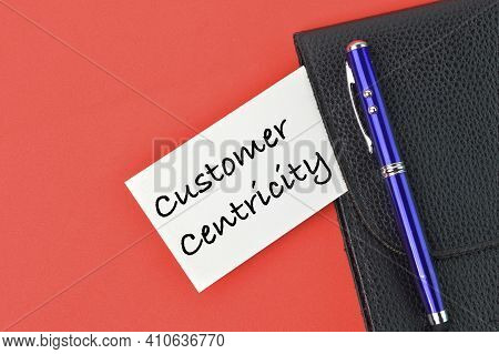Pen, Black File And Memo Note Written With Text Customer Centricity.