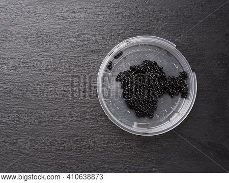 Paddlefish Black Caviar In A Plastic Plate,  Gourmet And Delicious Food, Top View