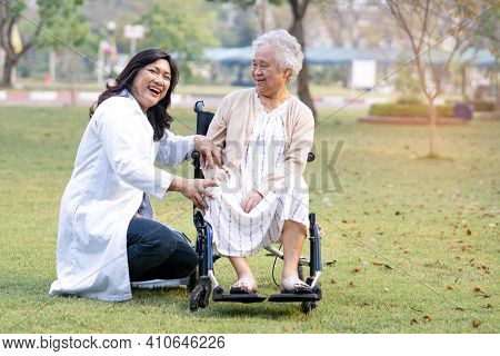 Doctor Help And Care Asian Senior Or Elderly Old Lady Woman Patient Sitting On Wheelchair At Park In