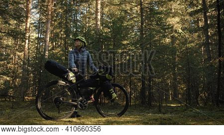 The Woman Travel On Mixed Terrain Cycle Touring With Bike Bikepacking. The Traveler Journey With Bic