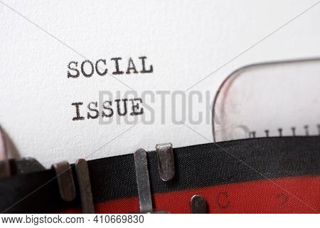 Social issue phrase written with a typewriter.