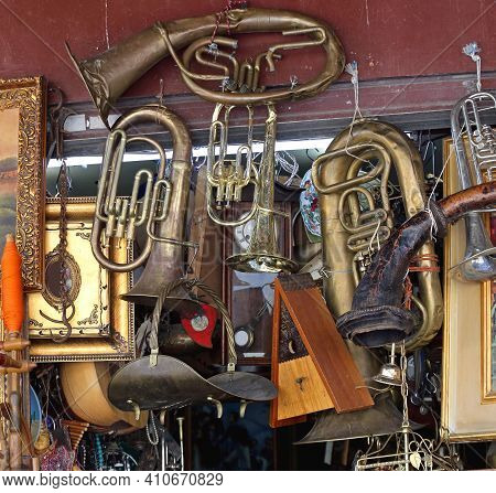 Damaged Beaten Brass Musical Instruments At Antique Market