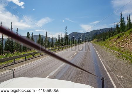 Photo From The Car Window While Traveling In The Altai Republic In The Summer Season. High Mountains