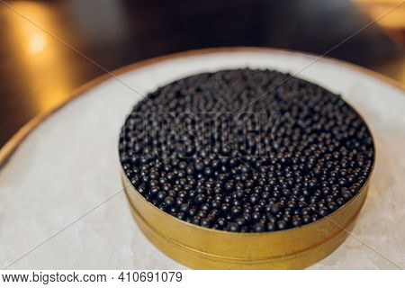 Paddlefish Black Caviar In A Plastic Plate, Gourmet And Delicious Food, Close Up.