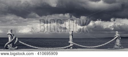 Panoramic View On Black And White Seafront, Sea And Cloudy Storm Sky. Turkey, Erdek, Coast Of Marmar